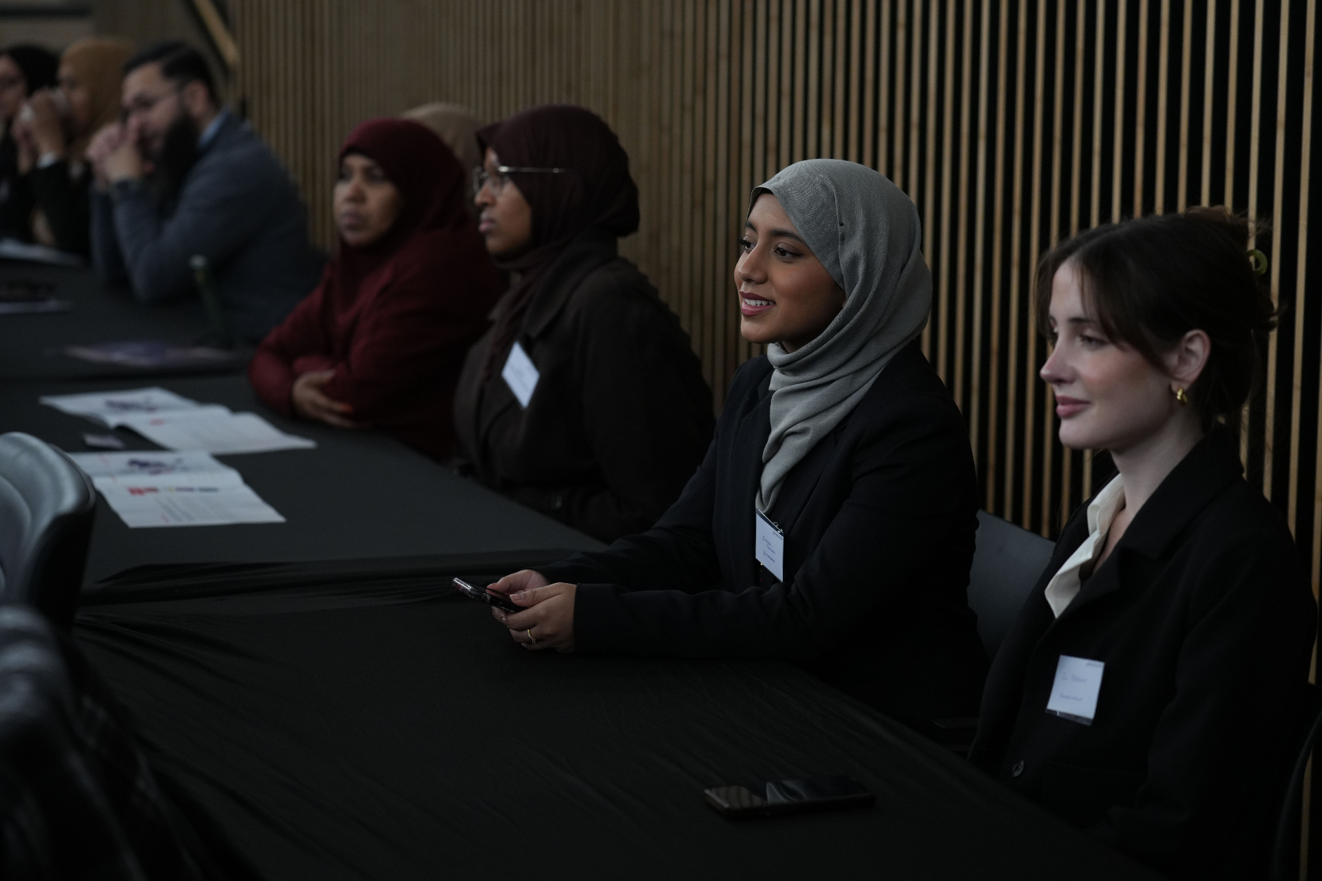 Attendees engaging with the panel