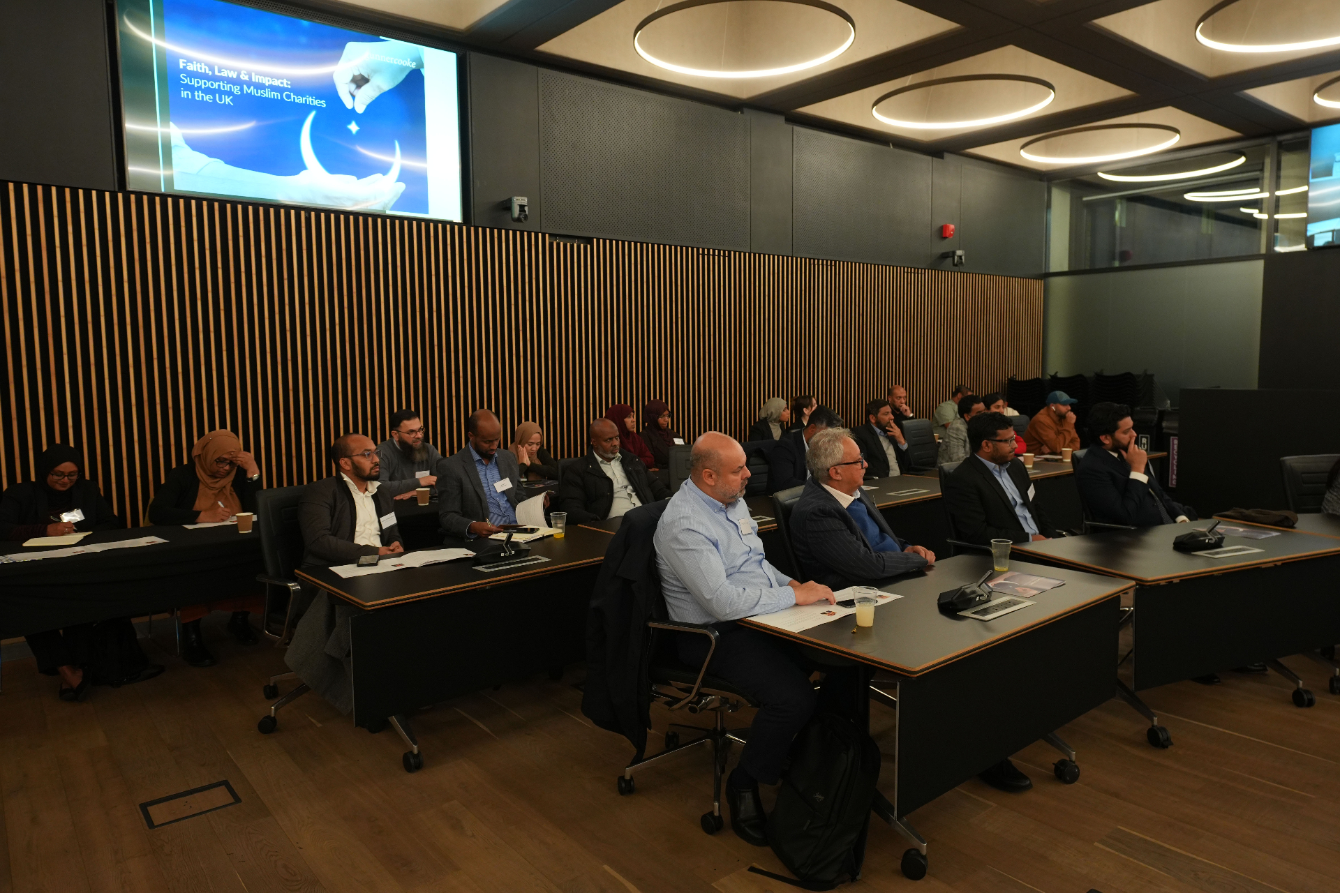 Attendees seated across the chamber